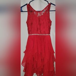 Beautiful girls red dress. Very flower and lots of sparkle in fabric. Size 8